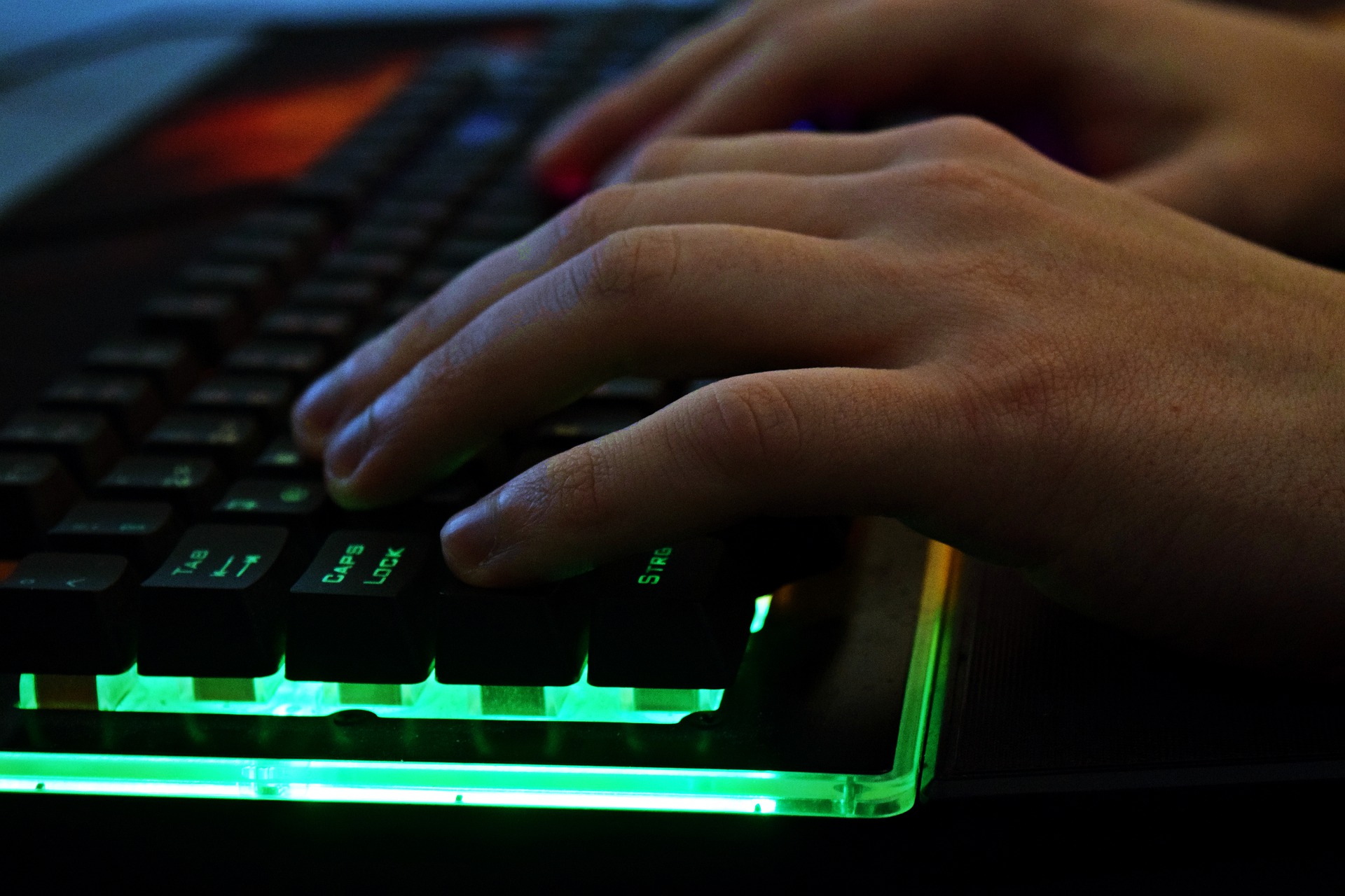 A close up of a hand on a computer keyboard